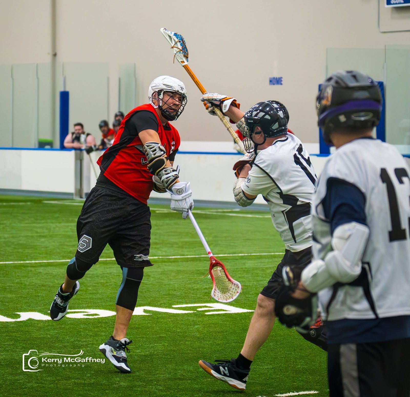 Two players battling at the crease
